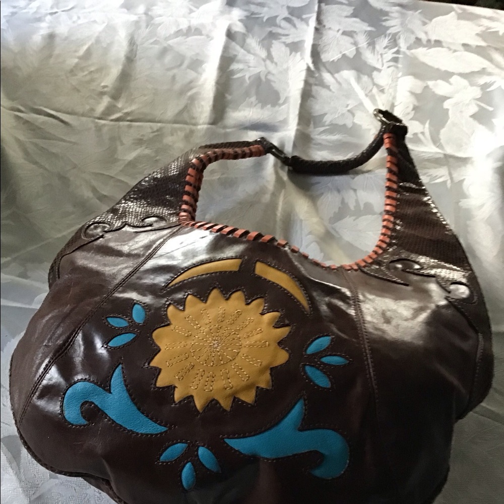 BCBGirls leather bag.  Lots of detail